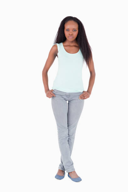 istock Woman standing with legs crossed on white background 827158056