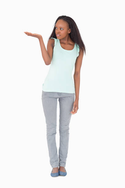 istock Woman holding something up on white background 827158158