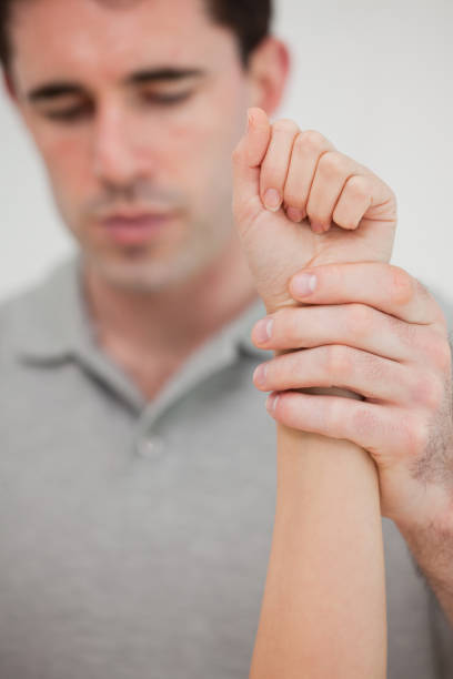 istock Close up of a hand being stretched 827161822