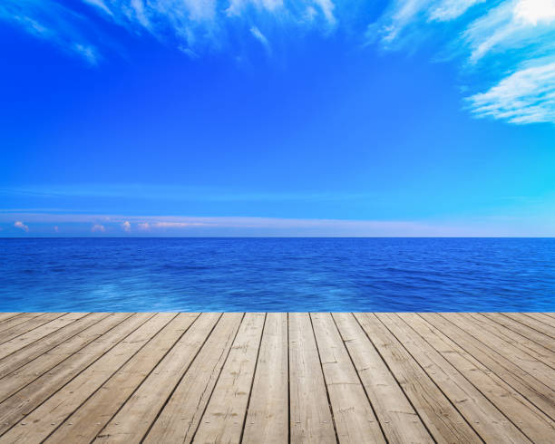 istock Wooden deck towards dreamlike landscape 827164036