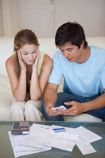 istock Portrait of a couple looking at their bills 827170708