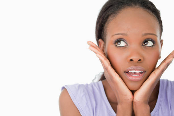 istock Close up of woman being afraid on white background 827180308