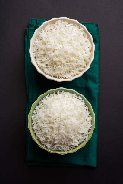 istock basmati rice in a ceramic bowl, indian white and long basmati rice cooked and served in bowl, selective focus 827183738