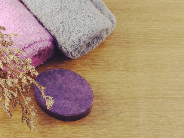 istock colorful hand made soap with towel on space background 827187714
