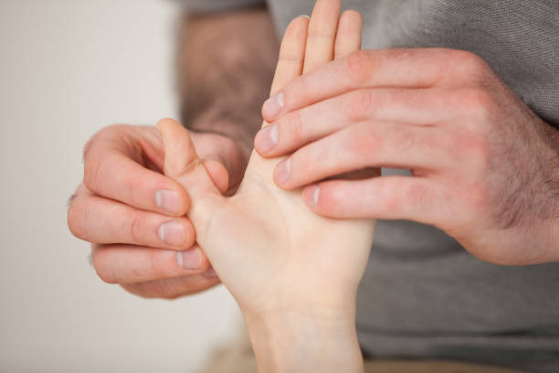 istock Thumb being massaged by a doctor 827190682