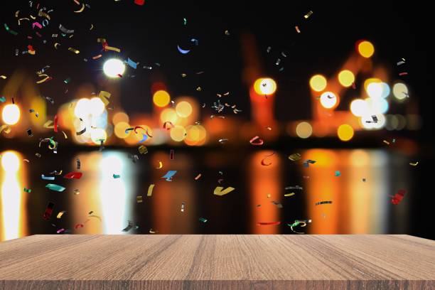 Empty wood table and ribbon motion multicolored,   light bokeh for Christmas  New Year background. with copy space  add  text