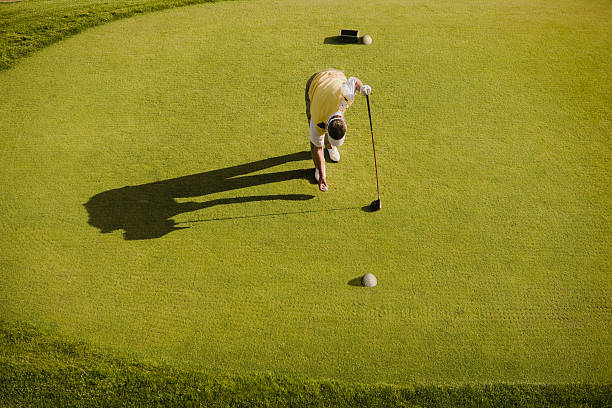 Golfer readying ball in tee box  golf concentration stock pictures, royalty-free photos & images