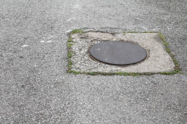 istock steel lid circle old  drain  on the road 827194810