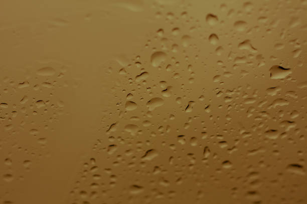 istock Natural water drops on glass 827197556
