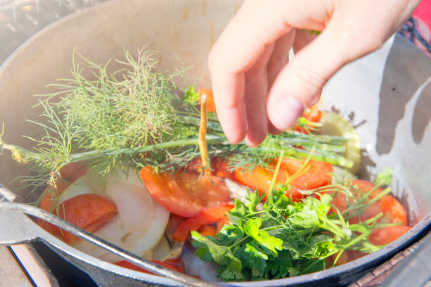 istock Cooking on the fire in a pot of vegetables. 827205918