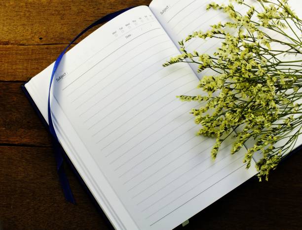 istock blank notebook page with flower decorate background 827206138