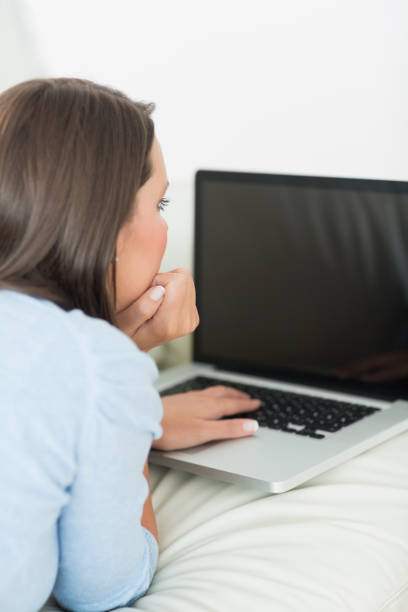 istock Brunette woman typing on the laptop 827212414