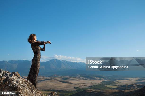 Girl Playing Violin On Nature Stock Photo - Download Image Now - Adults Only, Art, Arts Culture and Entertainment