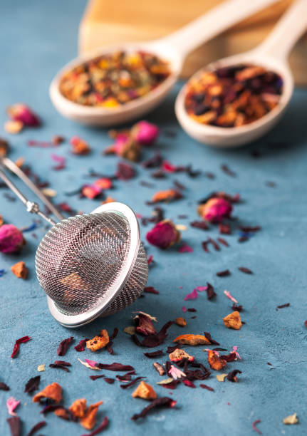 istock trainer for brewing tea, different types of tea, spices and dried roses 827215912