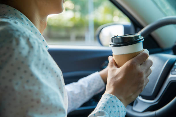 istock Man holding coffee in car 827215932