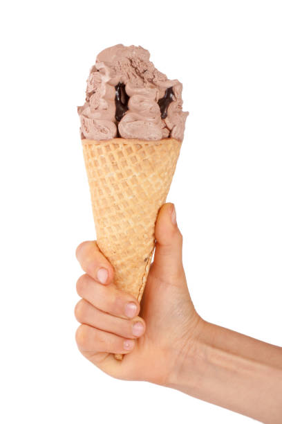 istock bitten chocolate ice cream in a waffle horn in the hand isolated 827215934