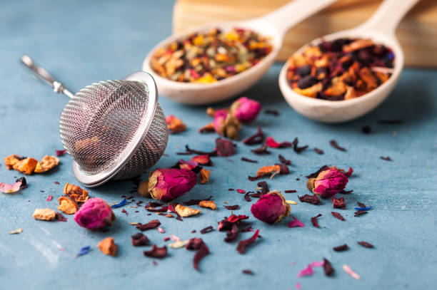 istock Strainer for brewing tea, different types of tea, spices and dried roses 827215952