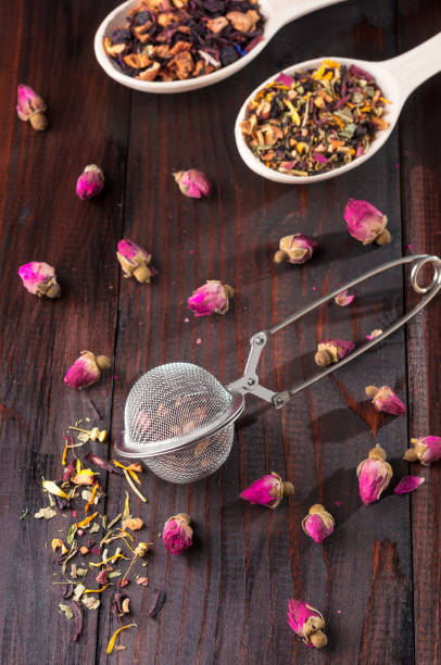 istock Strainer for brewing tea, different types of tea, spices and dried roses 827215978