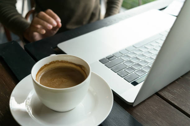 istock coffee and blur laptop on table wood background in cafe 827220384