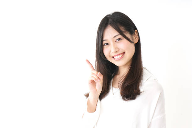 istock Young woman pointing something with smile 827222672