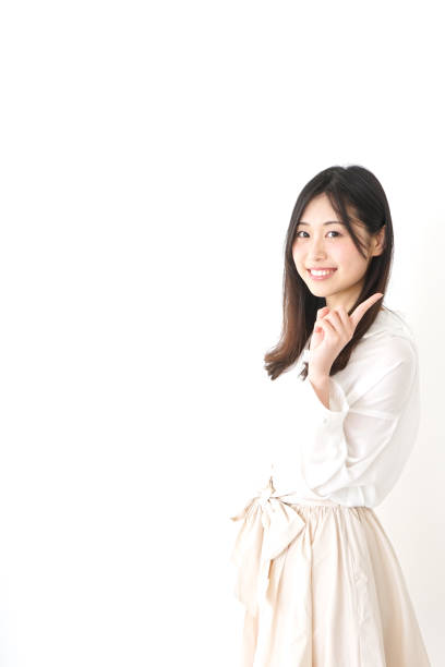 istock Young woman pointing something with smile 827222674