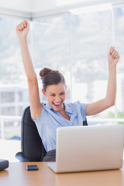 istock Successful businesswoman cheering 827223014