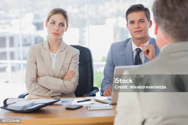 Happy Business People Interviewing Business Man Stock Photo - Download Image Now - Gesturing, Arms Crossed, Meeting