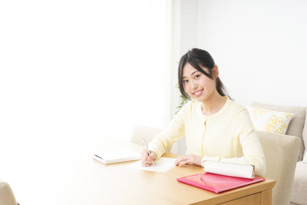 istock Young woman studying at home 827223918