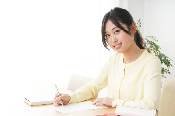 istock Young woman studying at home 827223926