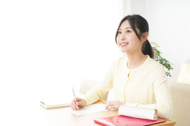 istock Young woman studying at home 827223932