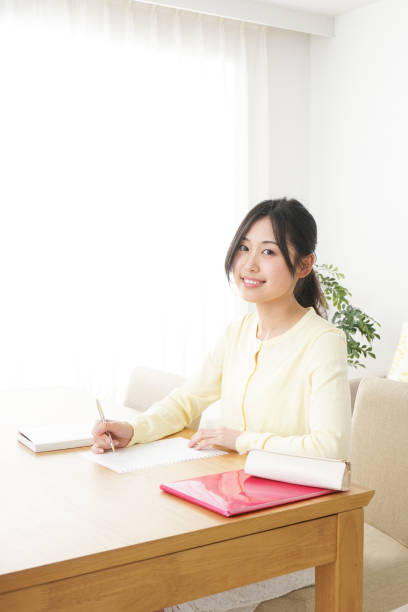 istock Young woman studying at home 827223944