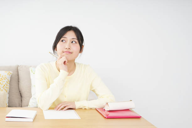 istock Young woman studying at home 827223946