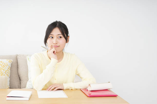 istock Young woman studying at home 827223954