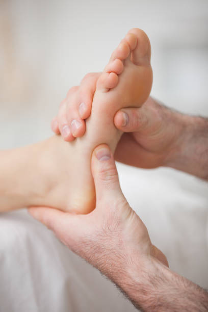 istock Foot receiving a massage by a physiotherapist 827227202