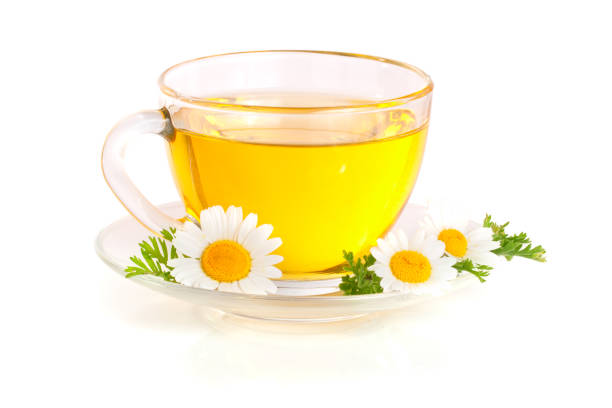 istock Herbal tea with fresh chamomile flowers isolated on white background 827227694