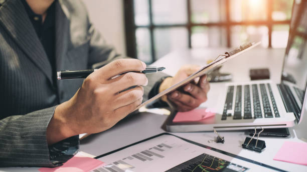 istock Audit concept,Bookkeeper or financial inspector and secretary making report 827234624