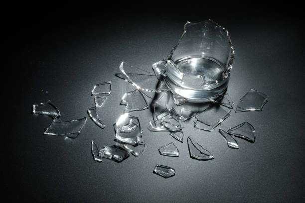istock A breaking glass of water on the black background 827238578