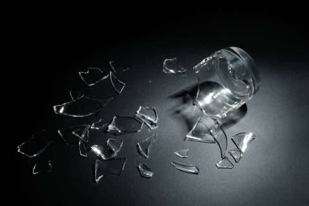 istock A breaking glass of water on the black background 827238700