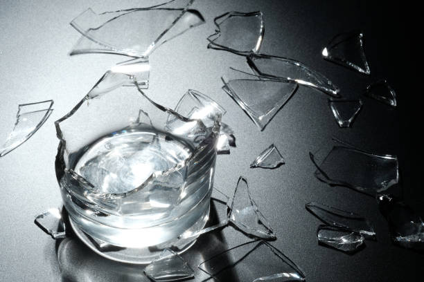 istock A breaking glass of water on the black background 827238738
