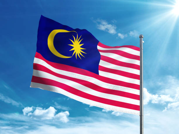 istock Malaysia flag waving in the blue sky 827242010