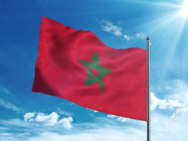istock Morocco flag waving in the blue sky 827242050