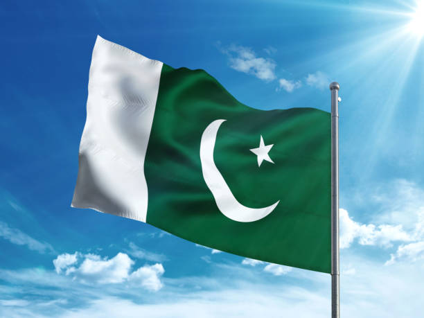 istock Pakistan flag waving in the blue sky 827242060