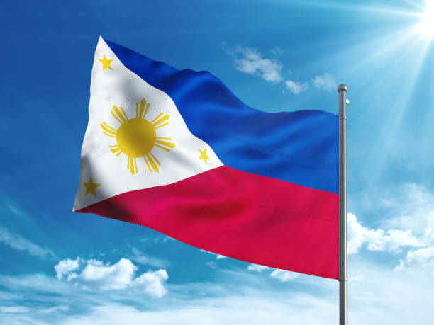 istock Philippines flag waving in the blue sky 827242102