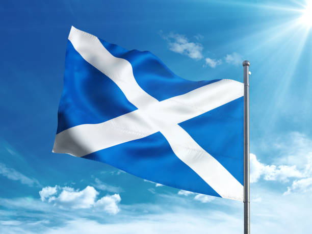 istock Scotland flag waving in the blue sky 827242190