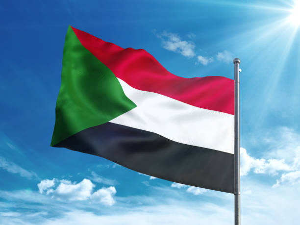 istock Sudan flag waving in the blue sky 827242244