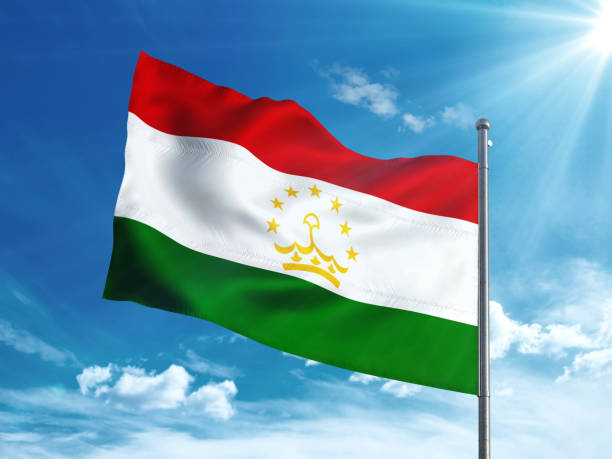 istock Tajikistan flag waving in the blue sky 827242276