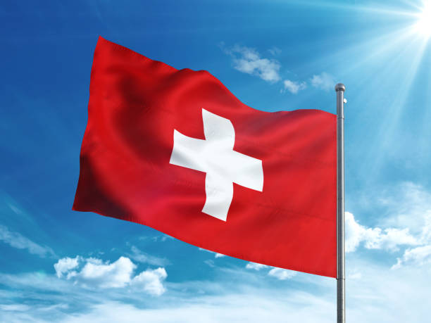 istock Switzerland flag waving in the blue sky 827242278