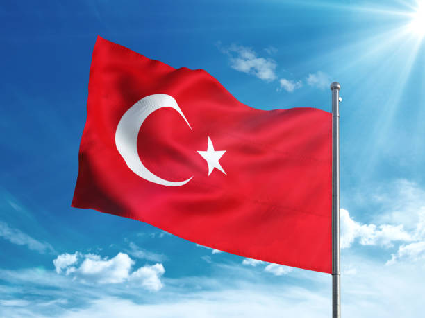istock Turkey flag waving in the blue sky 827242340