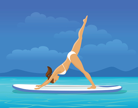 Woman doing Stand Up Paddling Yoga on Paddleboard on Water