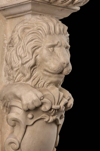istock plaster lion sculpture, pommel column on a black background 827246236